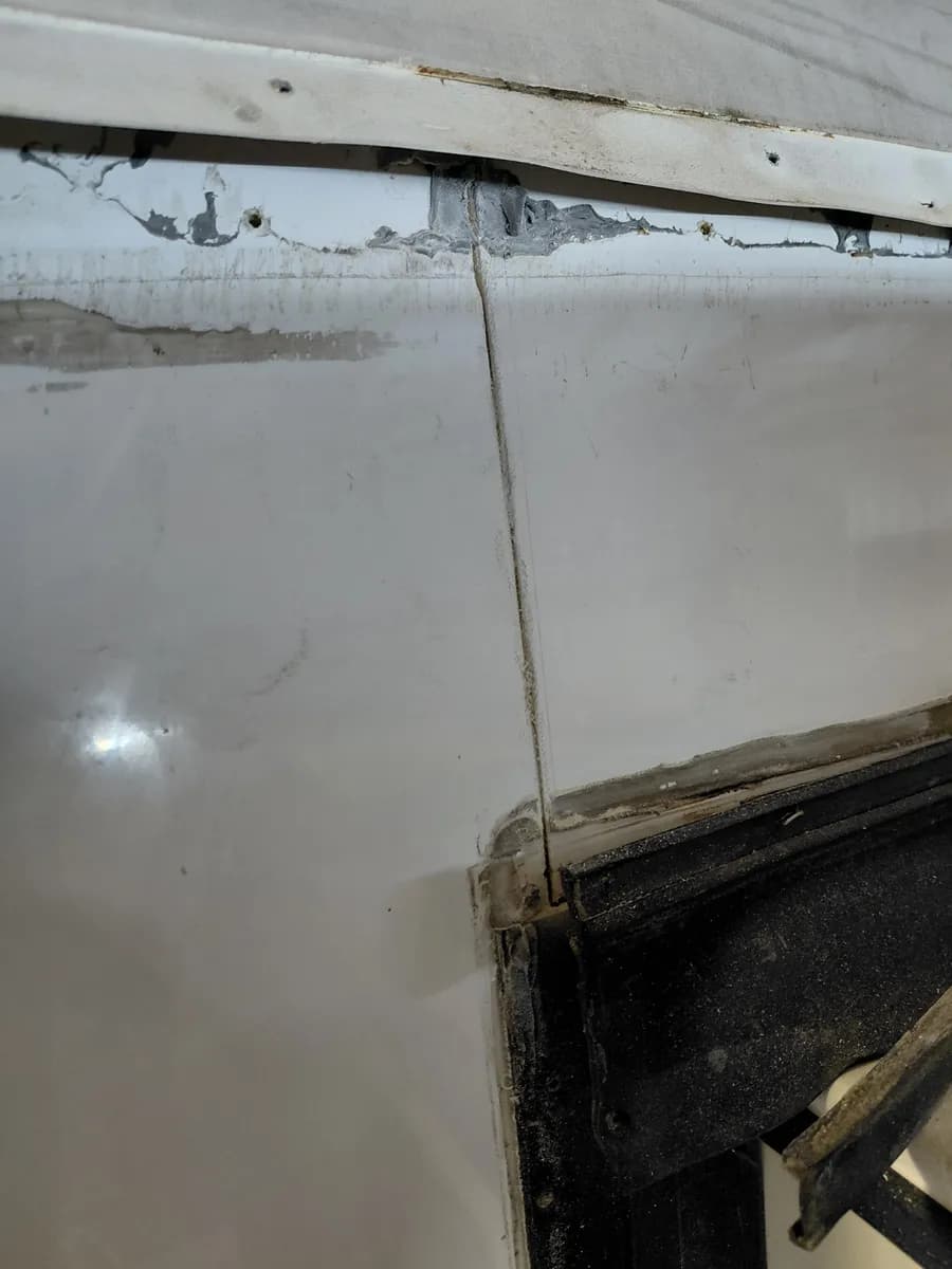 Fiberglass crack at the Fuzion slide corner before repair