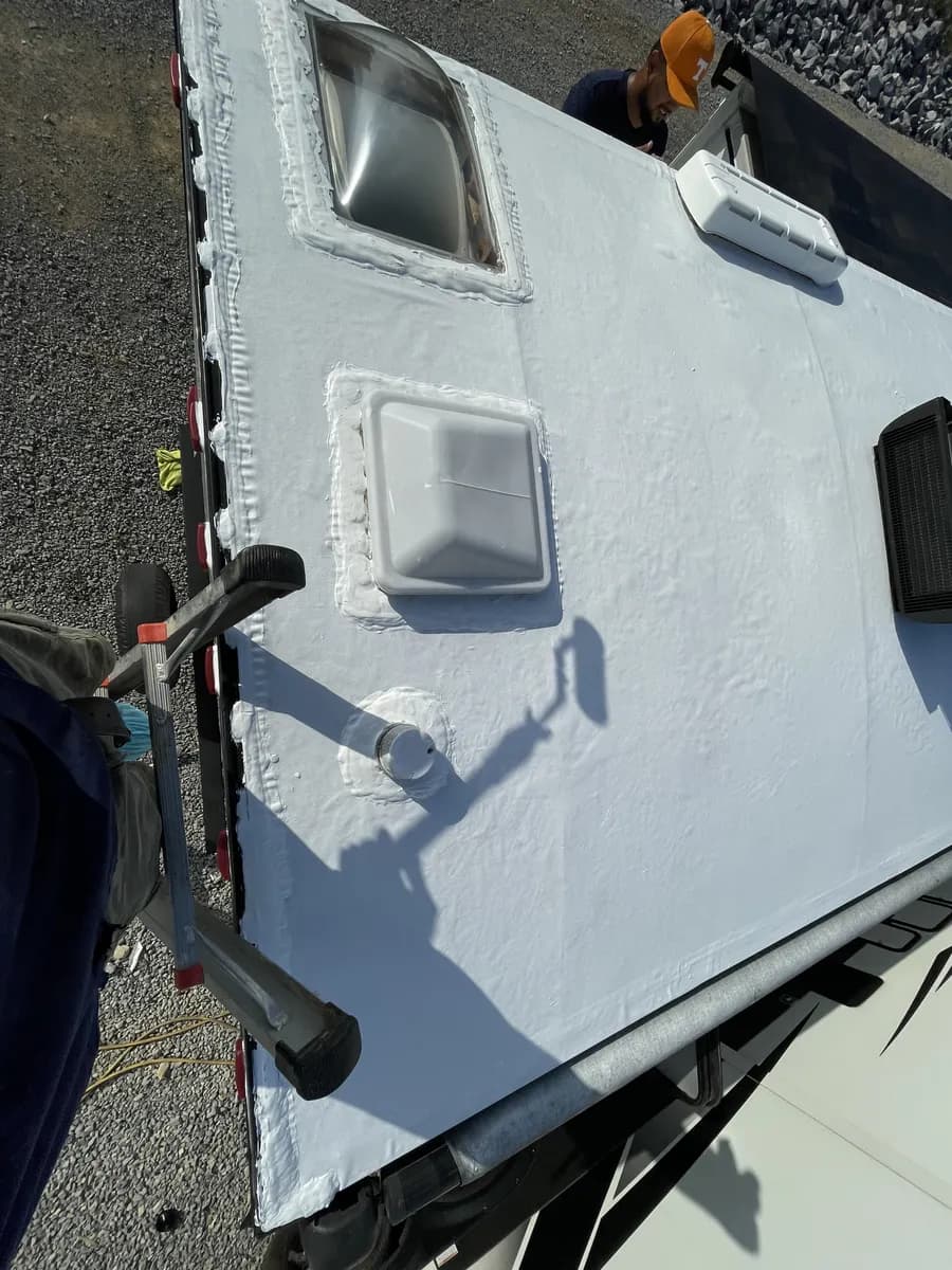 Radiance camper roof edge showing damaged trim and water entry points before repair