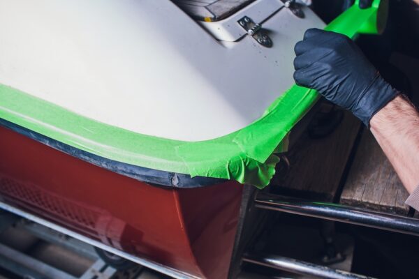 preparation for yacht repair. adhesive tape for non-flow. small yacht angler